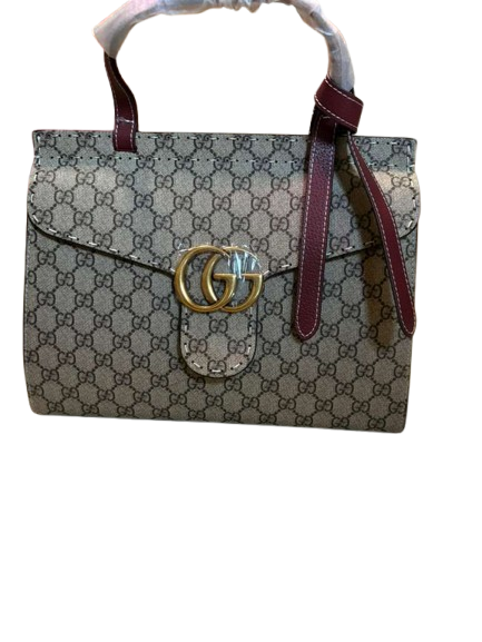 iconic GG Supreme canvas with red trim