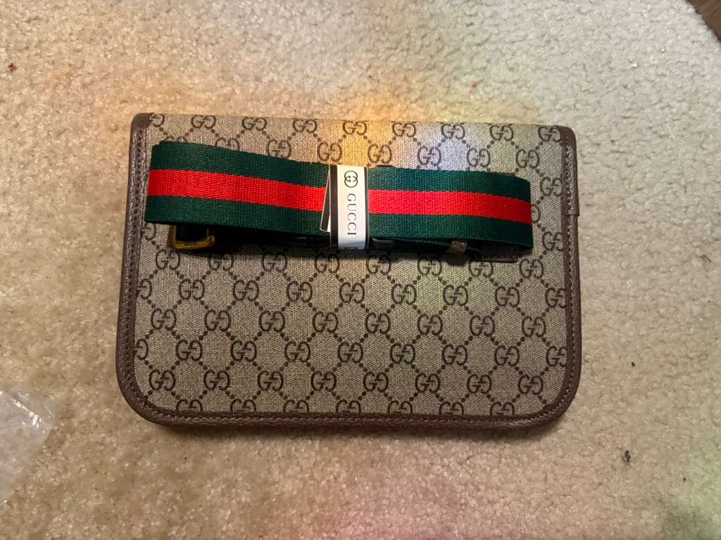 Gucci’s signature GG Supreme canvas
