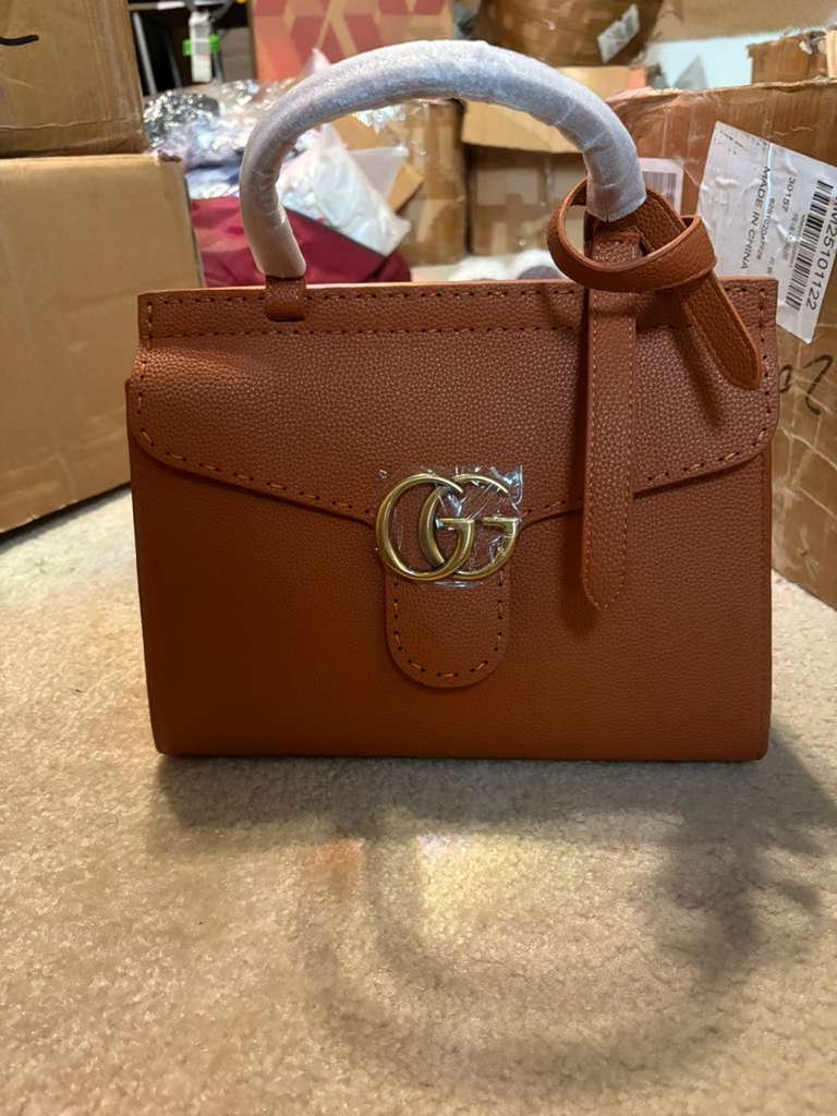 iconic GG Supreme canvas with red trim