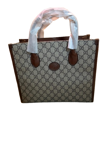 Gucci’s signature GG Supreme canvas - Small Tote Bag