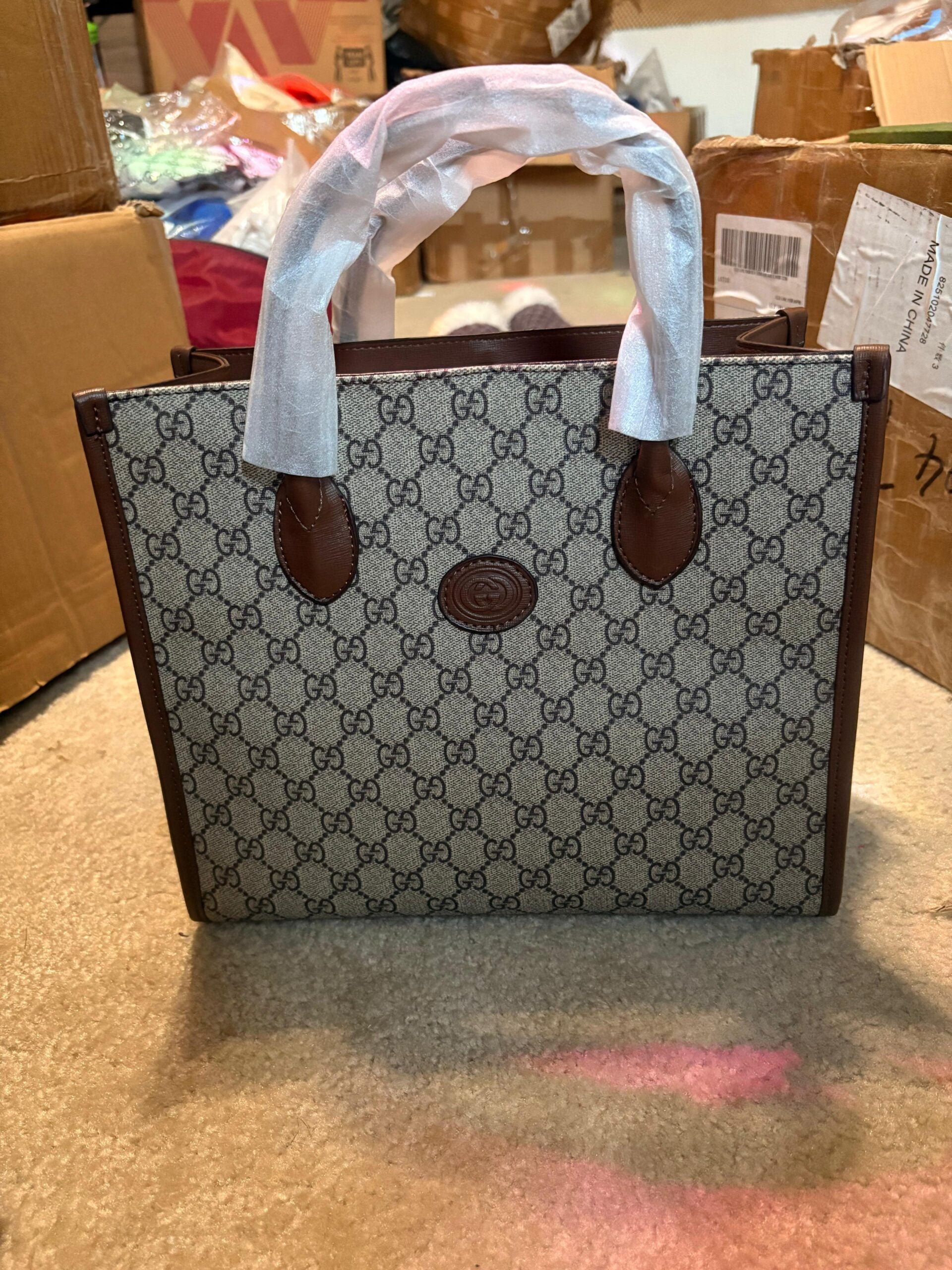 Gucci’s signature GG Supreme canvas