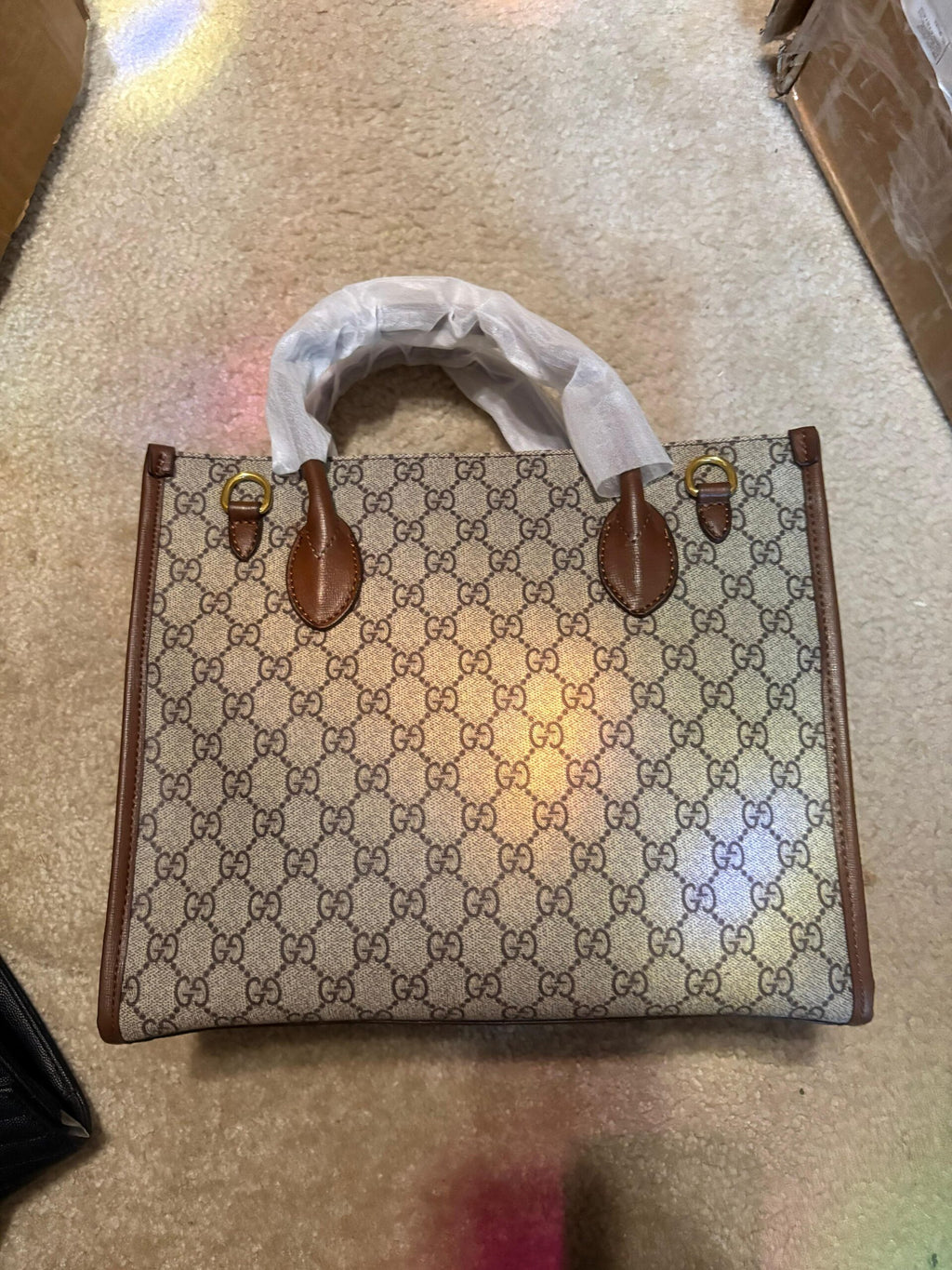 Gucci’s signature GG Supreme canvas