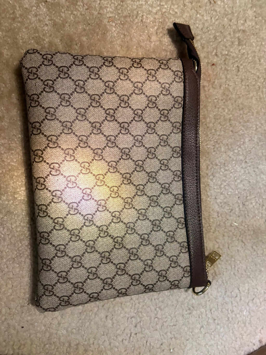 Gucci’s signature GG Supreme canvas