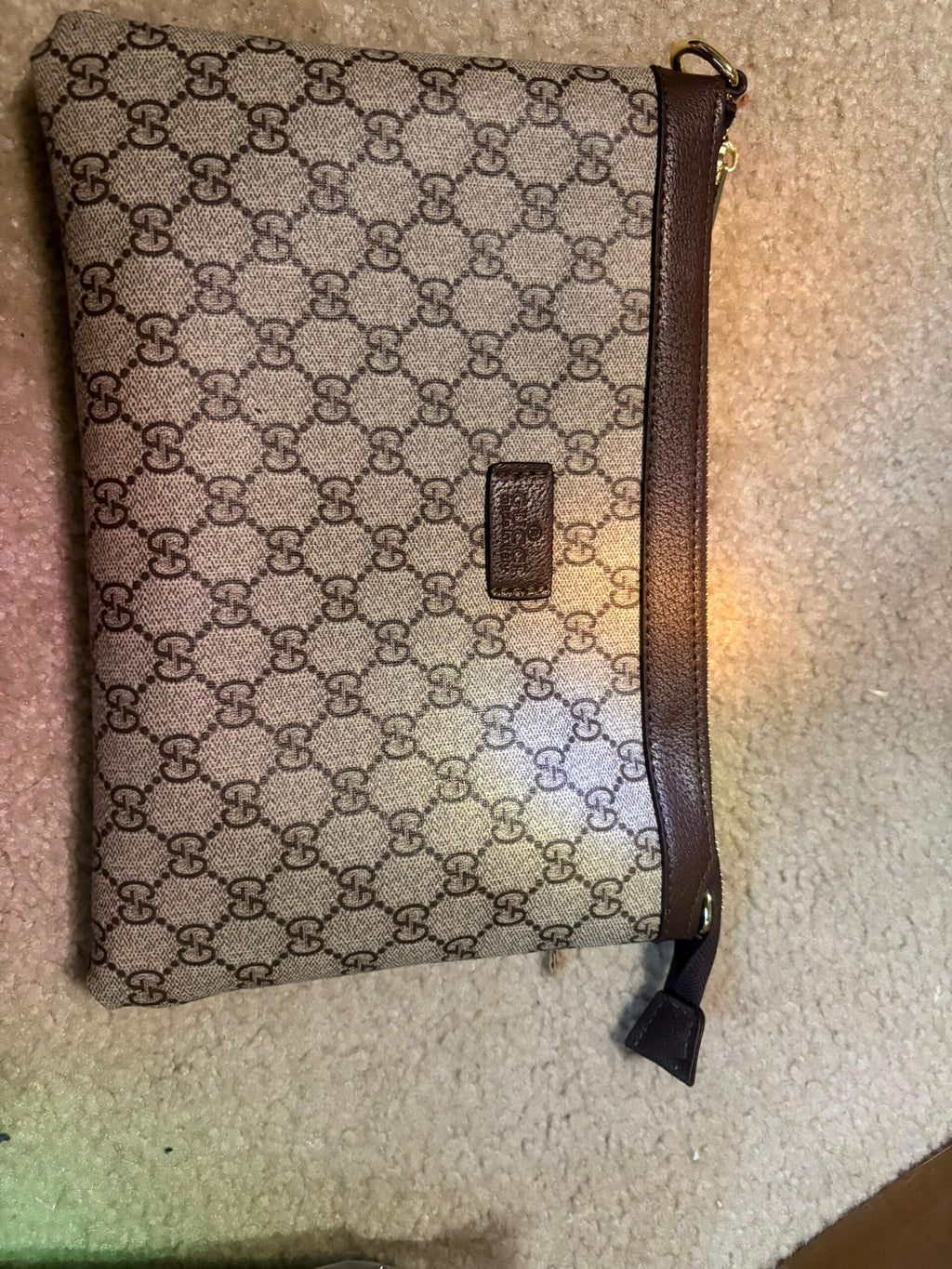 Gucci’s signature GG Supreme canvas