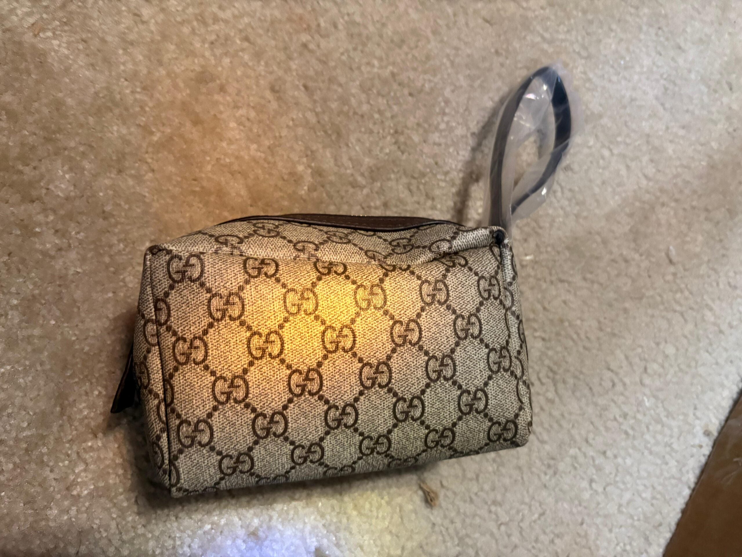 Gucci’s signature GG Supreme canvas